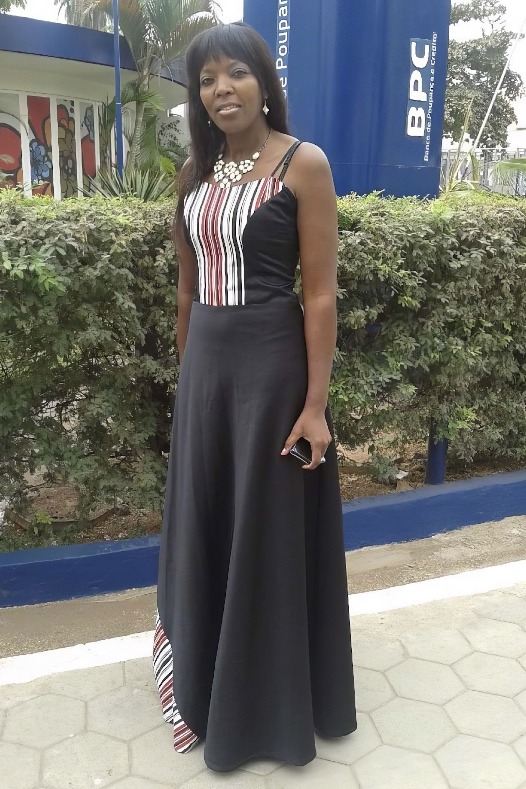 A model wearing a black dress.